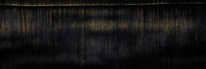Panoramic surface of black fabric denim grunge texture gold dark tone. Banner, background design images. Blank copy space Close-up - obrazy, fototapety, plakaty