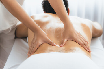 Caucasian man customer enjoying relaxing anti-stress spa massage and pampering with beauty skin...
