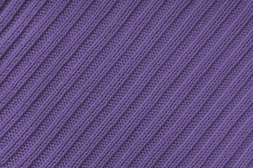 Fototapeta premium Jersey textile background , purple diagonal striped knitted fabric. Woolen knitwear, sweater, pullover surface texture, textile structure, cloth surface, weaving of knitwear material
