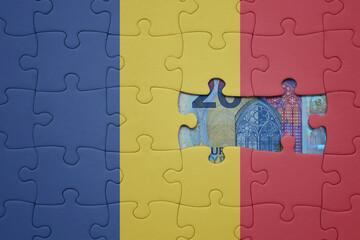 puzzle with the national flag of romania and euro banknote. finance concept