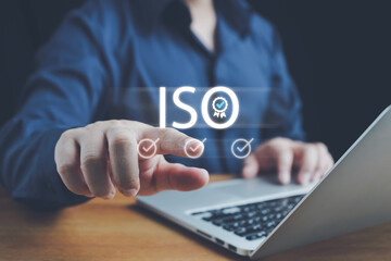 ISO standards quality control, Customer Satisfaction Guarantee concept on virtual screens, ISO, Standardization, Businessman using laptop computer with quality assurance and document icon for ISO.