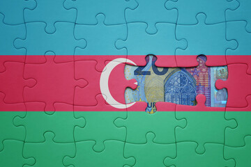 puzzle with the national flag of azerbaijan and euro banknote. finance concept