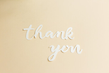 Simple Thank You Cutout Letters on Beige Surface