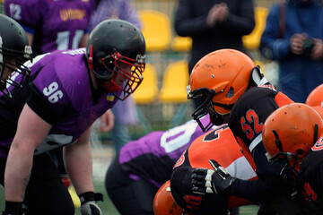American football players close-up before the start of the fight for the ball	
