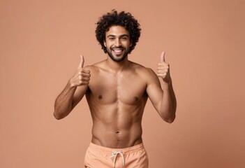 Fototapeta premium Energetic man without a shirt giving double thumbs up, his smile and physique showcasing his dedication to fitness and wellness.