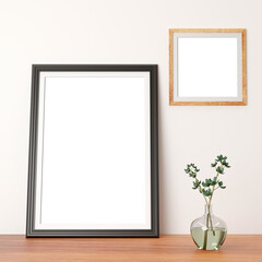large portrait photo frame and a small wooden square frame on the wall