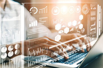Big Data Technology for Business Finance Analytic Concept. Modern interface shows massive information of business sale report, profit chart and stock market trends analysis on screen monitor. uds