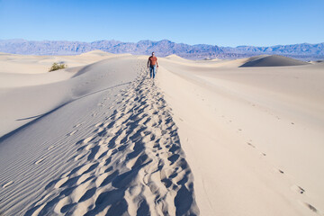 Man walking on the Mesquite Flat Sand Dunes, Death Valley National Park, California