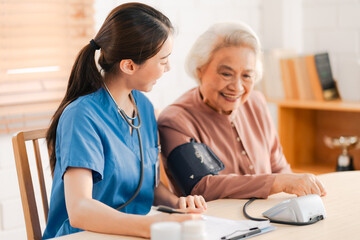 Medical health insurance service, Asian caregiver doctor examine older patient use blood pressure...