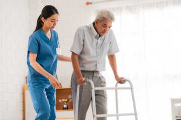 Fototapeta na wymiar Asian physiotherapist nursing home to support old senior man patient therapy by walker, caregiver nurse help recovery health care with elderly retirement man person at home, health insurance concept