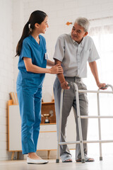 Asian physiotherapist nursing home to support old senior man patient therapy by walker, caregiver...