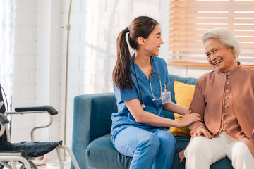 Health insurance service, Young Asian caregiver nurse examine senior man or woman patient at home....