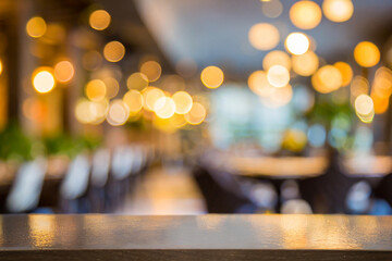 Blurred restaurant or cafe background. Tables and chairs in the lobby of restaurant. Visitors to...