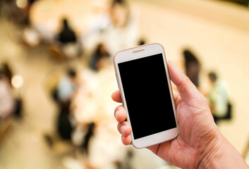 Hand holding smart phone of restaurant for background