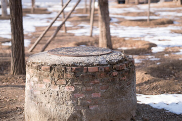 Well cover protruding from the ground