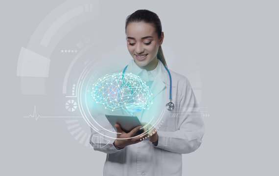 Female doctor with tablet computer on white background
