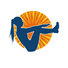 Silhouette of a slim sporty woman doing pilates exercise. Silhouette of a sporty female doing physical exercise. 