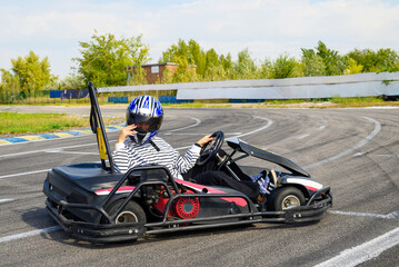 racer in a helmet at the start of the women's karting series