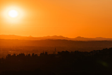 Colorful sunset on top of Italian mountain alps. Beautiful mountain landscape. Morning sunrise time mountain scenery.