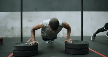 People, fitness and push ups in class for workout, exercise or training together at gym. Group of active bodybuilders for intense challenge, sports or teamwork in muscle or weightlifting on floor