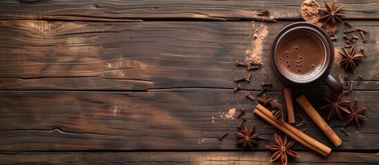 A cup of coffee sitting on a weathered wood surface, surrounded by cinnamon sticks and star anise. The warm beverage is the focal point, with aromatic spices complementing its rich flavor.