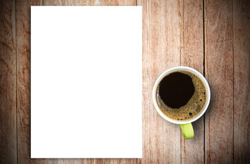 Top view of blank paper and cup of coffee on vintage wooden table background.