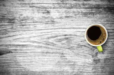 Black coffee cup on old wooden table