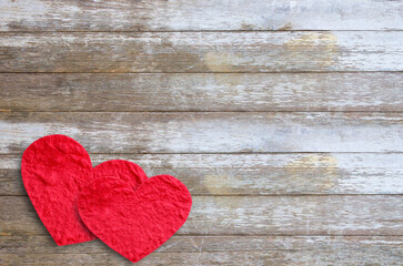 Red paper heart on wood table with copy space