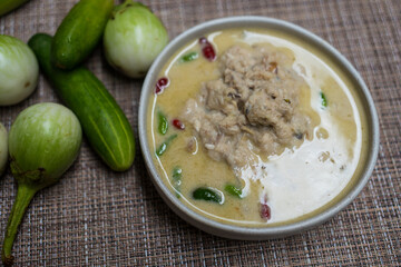 Fermented fish spicy dip served with fresh green eggplant and cucumber. Thai food