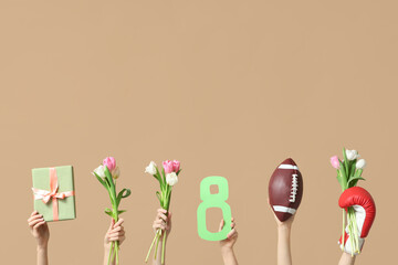 Female hands with sports equipment, gift box and tulip flowers for International Women's Day on color background