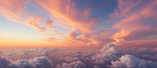 The image captures a cloudy sky during twilight at sunset as seen from an airplane window. The suns rays cast a warm glow on the clouds, creating a serene and peaceful atmosphere.
