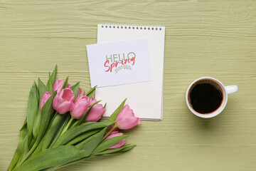 Greeting card with text HELLO SPRING, beautiful tulips, notebook and cup of coffee on green wooden background