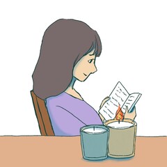 読書をする女性とキャンドル