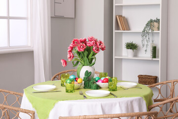 Beautiful table serving for Easter celebration in light dining room