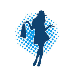 Silhouette of a slim young woman carrying shopping bags.