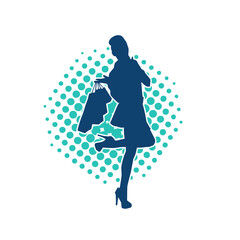 Silhouette of a slim young woman carrying shopping bags.