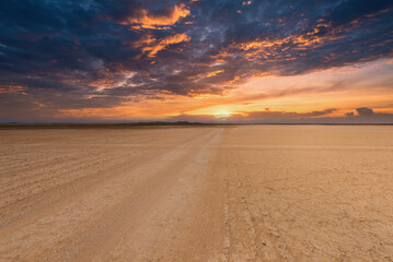 Fototapeta na wymiar sunset with beautiful orange sky in the carrizales desert. Guajira, Colombia.
