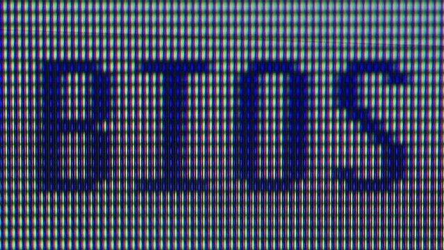 Pixel on old vintage computer monitor close-up. Computers cursor macro. Desktop vintage retro wave display, late 90s PC.