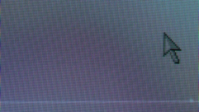 Pixel on old vintage computer monitor close-up. Computers cursor macro. Desktop vintage retro wave display, late 90s PC.