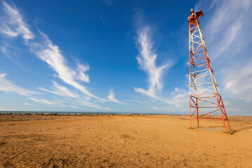 Punta Gallinas lighthouse and blue sky with clouds. Guajira, Colombia.