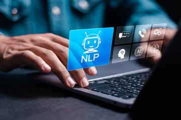 NLP natural language processing cognitive computing technology concept. Businessman use laptop with NLP icon on virtual screen.