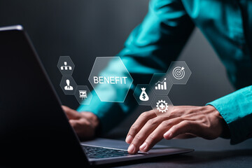 Benefit concept. Employee benefits help to get the best human resources. Businessman use laptop with BENEFIT word on virtual screen - obrazy, fototapety, plakaty