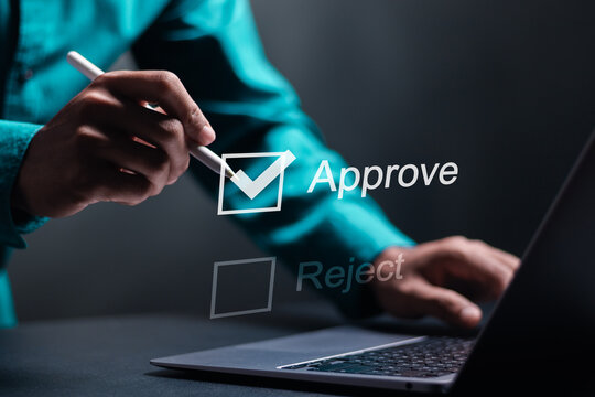 Option to approve or reject. Businessman tick a checkbox with the text approve. Deciding between approve or rejecting for business project.