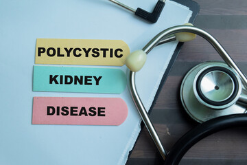 Concept of Polycystic Kidney Disease write on sticky notes with stethoscope isolated on Wooden...