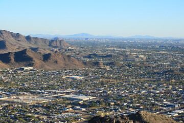 Arizona Valley of the Sun or Greater Phoenix Metro area as seen from North Mountain Park hiking trails toward South-East on late afternoon, copy space