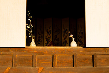 Flowers in window of traditional Korean Hanok house