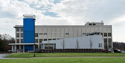 Fototapeta na wymiar Large Factory Building with Blue Accent
