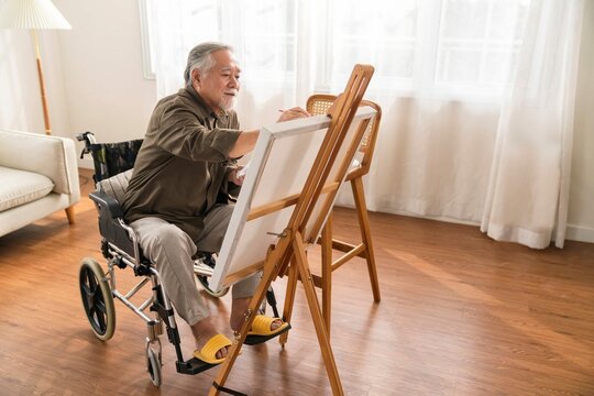 Old Senior Asian Male Using Art Therapy While His Legs Is Injured Homeasian Elder Man Spend Recovering His Leg Is Getting Better With Painting Canvas Art Living Room Home
