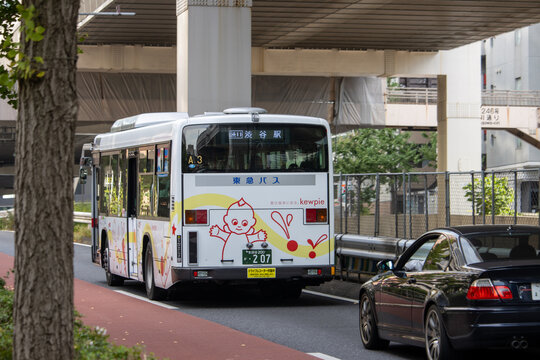 Tokyo, Japan, November 4 2023: City Bus with Kewpie Advertisement on Street.