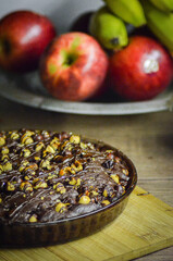 view of chocolate cake with hazelnuts, close up view of ice cream food background,